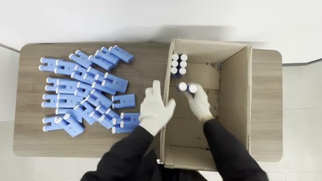 Battery cell packing, recorded from the worker’s point of view.